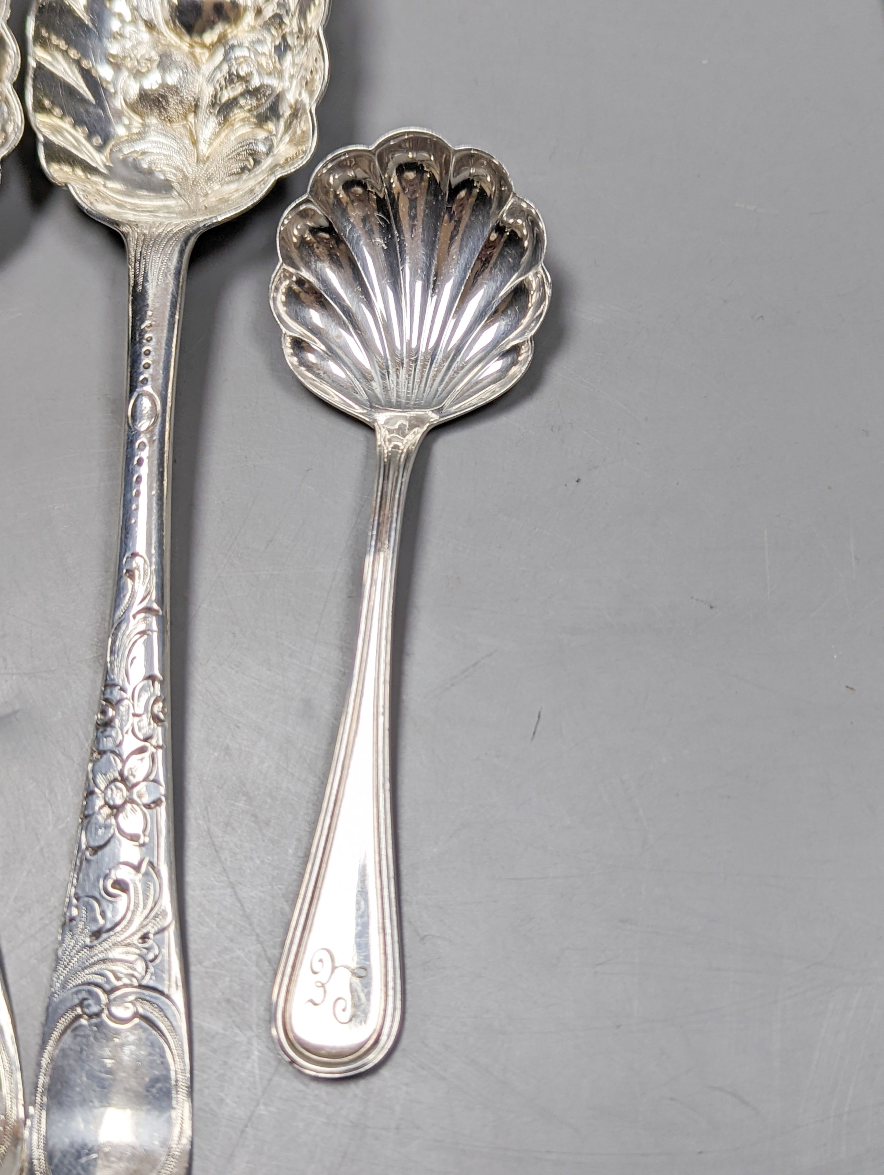 A pair of 18th century silver base mark 'berry spoons', marks pinched and sundry flatware including a Victorian silver pickle fork, a pair of silver sugar tongs, two 800 items of flatware and a pair Christofle plated sug